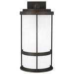 Generation Lighting - Wilburn Outdoor Wall Light in Antique Bronze - With a nod to retro-industrial chic, the Wilburn outdoor fixtures wraps a white frosted glass shade in a fun metal cage to create a casual and easygoing look. Offered in Antique Bronze and Black finishes with Etched White glass, the assortment includes a one-light outdoor pendant, small medium, large, and extra-large one-light outdoor wall lanterns, a one-light out door post lantern and a one-light outdoor ceiling flush mount. Both incandescent lamping and ENERGY STAR-qualified LED lamping are available for most of the fixtures, and some can easily convert to LED by purchasing LED replacement lamps sold separately.  This light requires 1 , 75W Watt Bulbs (Not Included) UL Certified.