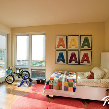 Pella® Designer Series fixed windows and hinged patio door enhance views