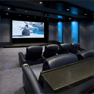 Home theater - mid-sized modern enclosed carpeted and gray floor home theater idea in Little Rock with a projector screen