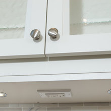 Electrical outlet underneath top cabinet