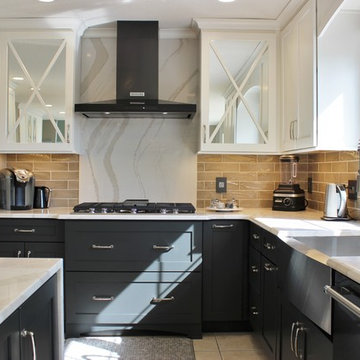 Quad Cities Kitchen With Gray Base Cabinets and Waterfall Counters
