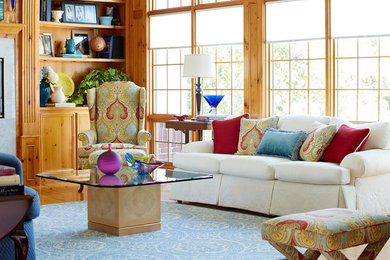 Large elegant formal and enclosed medium tone wood floor living room photo in Other with yellow walls, a standard fireplace and a stone fireplace