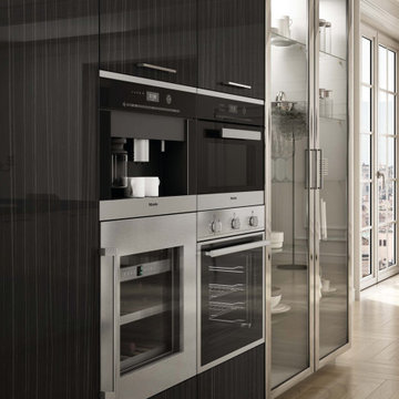 Modern black kitchen with stainless steel cabinets
