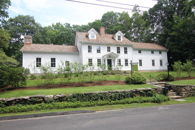 Traditional white two-story exterior home idea in New York with a shingle roof