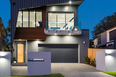 Design ideas for a contemporary two-storey grey house exterior in Brisbane with a flat roof and a metal roof.