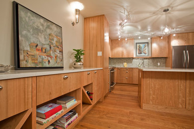 Mid-sized minimalist l-shaped medium tone wood floor and brown floor eat-in kitchen photo in Edmonton with an undermount sink, flat-panel cabinets, medium tone wood cabinets, quartz countertops, gray backsplash, stone tile backsplash, stainless steel appliances, an island and gray countertops