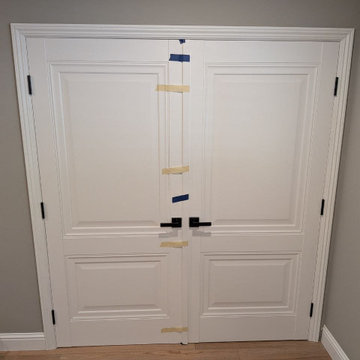 Lucia 8831 White double door with black dummy handles and magnetic catchers.