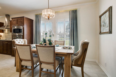 Example of a mid-sized transitional dark wood floor and brown floor kitchen/dining room combo design in Other with white walls