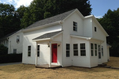 White two-story vinyl exterior home idea in Boston