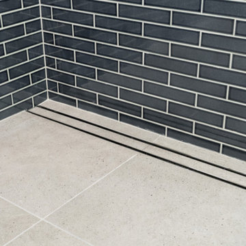 Linear Shower Drain with Large-Format Grey Porcelain Tile