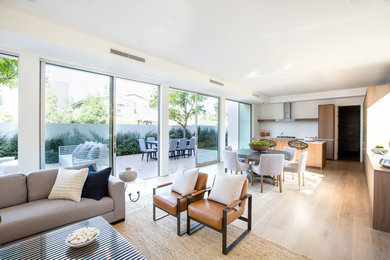 Living room - large contemporary formal and open concept light wood floor and beige floor living room idea in Los Angeles with white walls, no fireplace and no tv