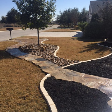 Natural edge Flagstone pathway w/ Xeriscape