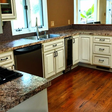 cabinet refacing---antique white w brown glaze, new countertops and backsplash