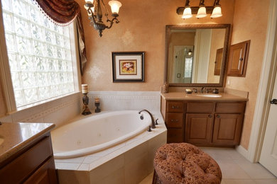 Inspiration for a mid-sized timeless master bathroom remodel in Houston with beige walls
