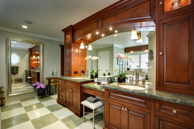 Inspiration for a large timeless master vinyl floor bathroom remodel in San Francisco with raised-panel cabinets, dark wood cabinets, an undermount sink, granite countertops and green countertops