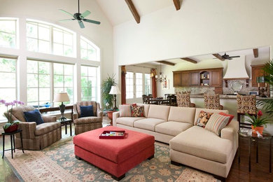 Inspiration for a large traditional open concept family room in Dallas with white walls and dark hardwood floors.