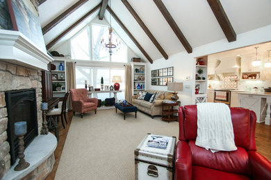 Inspiration for a small timeless open concept carpeted living room remodel in Milwaukee with white walls, a standard fireplace and a stone fireplace