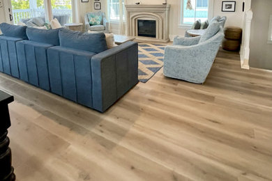 Inspiration for a coastal vinyl floor and beige floor living room remodel in Other
