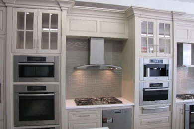 Inspiration for a kitchen remodel in Other with shaker cabinets, white cabinets, stone tile backsplash and stainless steel appliances