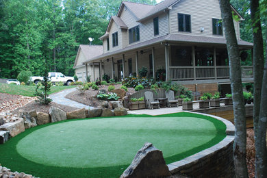 Inspiration for a traditional side yard outdoor basketball/tennis/multi-game court in Other.