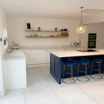 Traditional Kitchen with Navy Blue Island and White Natural Stone Effect Worktop