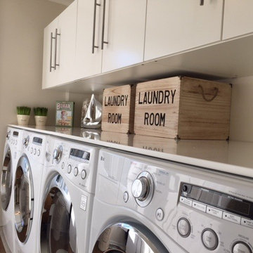 Super efficient 2 Washer and Dryer Laundry Room.