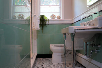 Example of a classic mosaic tile floor, multicolored floor and single-sink bathroom design in Other with green walls and a pedestal sink