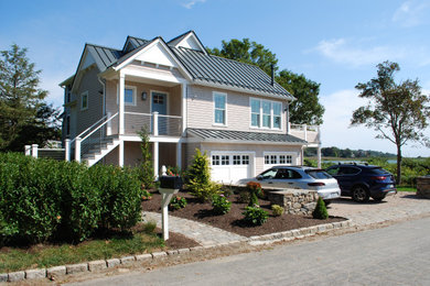 Large coastal two-story wood exterior home idea in Providence with a metal roof