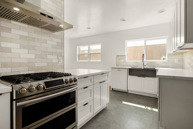 Eat-in kitchen - mid-sized contemporary galley ceramic tile and gray floor eat-in kitchen idea in Los Angeles with a double-bowl sink, white cabinets, quartz countertops, gray backsplash, ceramic backsplash, stainless steel appliances, white countertops and shaker cabinets