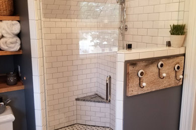 Inspiration for a mid-sized shabby-chic style master white tile and subway tile mosaic tile floor and multicolored floor corner shower remodel in Other with gray walls and a hinged shower door