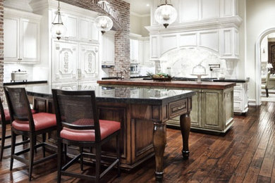 Inspiration for a large galley eat-in kitchen in Dallas with beaded inset cabinets, white cabinets, onyx benchtops, multiple islands and green benchtop.
