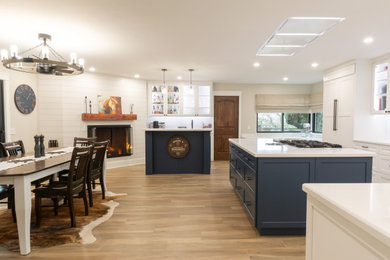 Huge mountain style l-shaped open concept kitchen photo in San Francisco with an undermount sink, shaker cabinets, white backsplash, ceramic backsplash, stainless steel appliances and an island