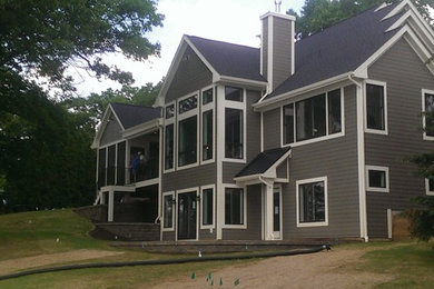 Example of a beach style exterior home design in Grand Rapids