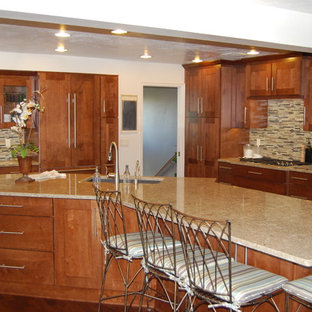 This is an example of a large asian l-shaped eat-in kitchen in Other with an undermount sink, recessed-panel cabinets, medium wood cabinets, multi-coloured splashback, mosaic tile splashback, with island, quartz benchtops, panelled appliances, dark hardwood floors and brown floor.