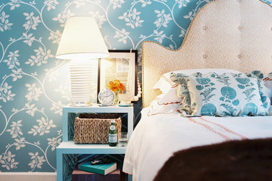 Example of a cottage chic bedroom design in New York with blue walls