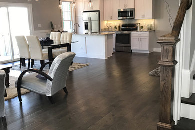 Mid-sized trendy formal and open concept dark wood floor and brown floor living room photo in Other with gray walls, no fireplace and no tv