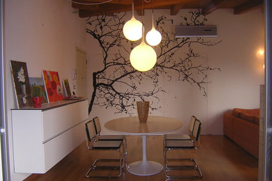This is an example of a contemporary dining room in Venice.