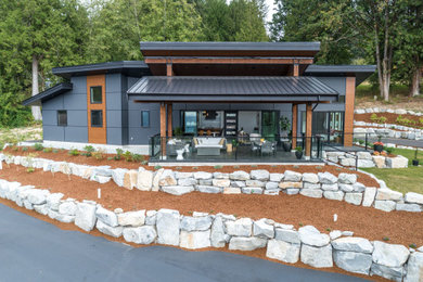 Example of a large trendy exterior home design in Other