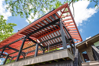 Inspiration for a backyard patio remodel in Milwaukee with a pergola