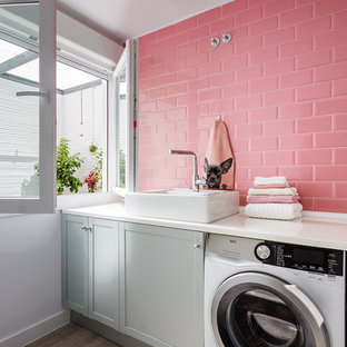 Inspiration for a medium sized contemporary single-wall separated utility room in Madrid with a single-bowl sink, grey cabinets, white walls, ceramic flooring, a side by side washer and dryer, grey floors and shaker cabinets.