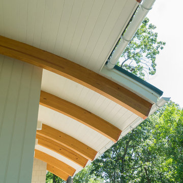Curved roof beams extending outside