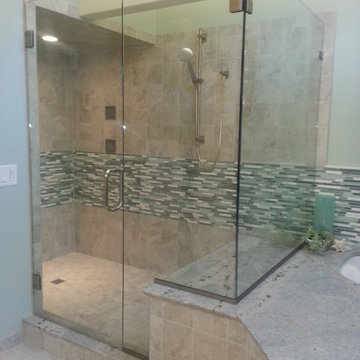 Walk-In Shower with Glass Doors and Mosaic Tile Walls