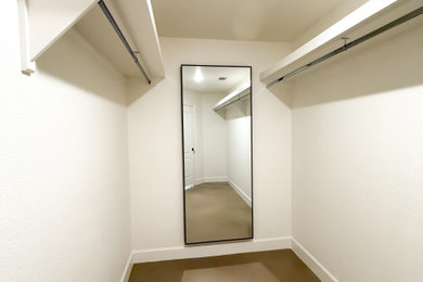 Example of a transitional closet design in Austin