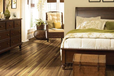 Bedroom - mid-sized transitional guest dark wood floor bedroom idea in Other with beige walls and no fireplace