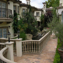 cast stone window frame with iron railing