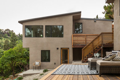 Trendy beige two-story stucco house exterior photo in Los Angeles