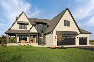 Large elegant gray two-story wood and board and batten exterior home photo in Minneapolis with a mixed material roof and a black roof