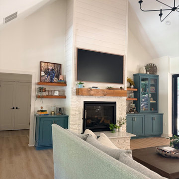Vaulted Living Room with Floor-to-Ceiling Shiplap Fireplace and Teal Built-Ins
