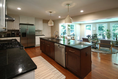 Inspiration for a large contemporary kitchen remodel in Raleigh with an island