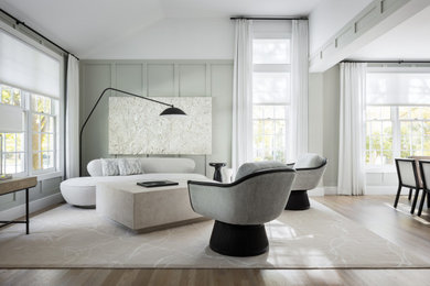 Inspiration for a mid-sized contemporary formal and open concept light wood floor living room remodel in New York with gray walls